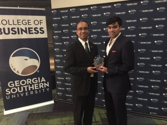 Dominique Halaby, D.P.D., director of the Business Innovation Group, stands with Swarnav Pujari of Touch Light Innovations, the 2016 BIG Pitch winner.
